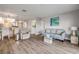 A well-lit living space with hardwood floors, light colored walls, and modern furnishings at 2700 N Peninsula Ave # 513, New Smyrna Beach, FL 32169