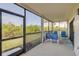 Spacious screened patio featuring comfortable lounge furniture and a peaceful setting at 2700 N Peninsula Ave # 513, New Smyrna Beach, FL 32169