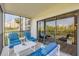 Relax on this breezy patio with comfortable seating and serene views at 2700 N Peninsula Ave # 513, New Smyrna Beach, FL 32169