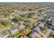 Aerial view of a quiet residential neighborhood with tree-lined streets and well-maintained homes at 2828 Pine Tree Dr, Edgewater, FL 32141