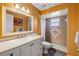 Updated bathroom with a large vanity, updated shower stall, and neutral tile at 2828 Pine Tree Dr, Edgewater, FL 32141
