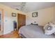 Bedroom with wood flooring, ceiling fan, and closet for great storage at 2828 Pine Tree Dr, Edgewater, FL 32141
