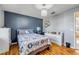 Bedroom features wood flooring and a chandelier that enhances the room's appeal at 2828 Pine Tree Dr, Edgewater, FL 32141