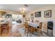 Charming dining area with tile flooring, natural light, and seamless access to the kitchen and living spaces at 2828 Pine Tree Dr, Edgewater, FL 32141