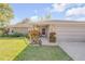 Inviting home exterior with stone accents and colorful landscaping at 2828 Pine Tree Dr, Edgewater, FL 32141