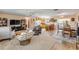 Open-concept living area flowing into the kitchen with ample seating at 2828 Pine Tree Dr, Edgewater, FL 32141
