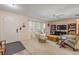 Cozy living room featuring carpet, comfortable seating, and natural light at 2828 Pine Tree Dr, Edgewater, FL 32141