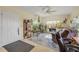 Bright sunroom filled with natural light, featuring large windows and comfortable seating at 2828 Pine Tree Dr, Edgewater, FL 32141