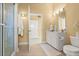 Bathroom features a walk-in shower and modern white vanity at 2901 Hill St, New Smyrna Beach, FL 32169