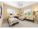 Bright bedroom with twin beds, ceiling fan and natural light at 2901 Hill St, New Smyrna Beach, FL 32169