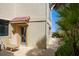 Charming home exterior with a seating area, lush landscaping and a glimpse of the beach nearby at 2901 Hill St, New Smyrna Beach, FL 32169