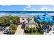 Beach house exterior with a driveway, mature landscaping, and close proximity to the beach at 2901 Hill St, New Smyrna Beach, FL 32169