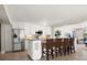 Clean, white kitchen with stainless steel appliances and breakfast bar seating for four at 2901 Hill St, New Smyrna Beach, FL 32169