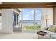 Cozy living room with access to an outdoor patio and ocean views through large sliding doors at 2901 Hill St, New Smyrna Beach, FL 32169