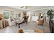 Spacious living room with an open floor plan, comfortable seating, and a neutral palette at 2901 Hill St, New Smyrna Beach, FL 32169