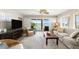 Bright living room with neutral tones, comfortable seating, and ocean views at 2901 Hill St, New Smyrna Beach, FL 32169