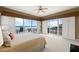 Bright main bedroom with large windows showcasing ocean views and access to a private balcony at 2901 Hill St, New Smyrna Beach, FL 32169