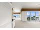 Bright main bedroom with sliding doors offering ocean views and access to a private balcony at 2901 Hill St, New Smyrna Beach, FL 32169