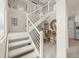 Contemporary staircase with white railings and convenient landing, connecting multiple levels of the home at 2901 Hill St, New Smyrna Beach, FL 32169