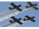 Four planes fly in formation, leaving smoke trails in this aerial airshow display at 2908 Cypress Ridge Trl, Port Orange, FL 32128