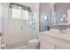 Stylish bathroom featuring a glass-enclosed shower, a vanity, and elegant fixtures for a modern touch at 2908 Cypress Ridge Trl, Port Orange, FL 32128