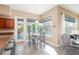 Cozy breakfast nook with views of the pool, tile floors, and casual dining space, perfect for morning coffee at 2908 Cypress Ridge Trl, Port Orange, FL 32128