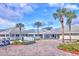 Spruce Creek Country Club exterior features manicured landscaping and inviting entrance at 2908 Cypress Ridge Trl, Port Orange, FL 32128