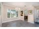 Bright dining area with pool views and tile floors, chandelier lighting, and neutral color palette at 2908 Cypress Ridge Trl, Port Orange, FL 32128