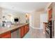 Open concept kitchen featuring a large island, stainless steel appliances, and seamless flow to living areas at 2908 Cypress Ridge Trl, Port Orange, FL 32128