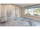 Bright living room with tile flooring and large windows offering plenty of natural light and open floor plan at 2908 Cypress Ridge Trl, Port Orange, FL 32128