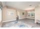 Spacious living room with tile floors, neutral walls, and an open doorway to the bedroom at 2908 Cypress Ridge Trl, Port Orange, FL 32128