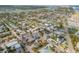 Wide aerial view showcases the home's location within a vibrant coastal community and nearby waterway at 301 N Cooper St, New Smyrna Beach, FL 32169
