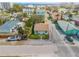 Aerial view of coastal home with turquoise accents, close proximity to the beach at 301 N Cooper St, New Smyrna Beach, FL 32169