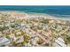 Aerial view showcases the home's proximity to the ocean, coastal community and nearby amenities at 301 N Cooper St, New Smyrna Beach, FL 32169