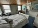Relaxing bedroom with a comfortable bed, natural lighting, and calming decor at 301 N Cooper St, New Smyrna Beach, FL 32169