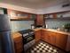 Compact kitchen with wooden cabinets, butcher block countertops, and modern appliances at 301 N Cooper St, New Smyrna Beach, FL 32169
