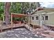 Charming backyard with a spacious wooden deck and dining area, perfect for outdoor entertaining at 303 Washington St, New Smyrna Beach, FL 32168