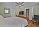 Comfortable bedroom with hardwood floors, ceiling fan, and ample storage at 303 Washington St, New Smyrna Beach, FL 32168