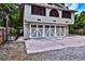 Garage door with unique design and a driveway at 303 Washington St, New Smyrna Beach, FL 32168
