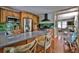 Spacious kitchen featuring stainless appliances, a breakfast bar, and seamless access to living area at 303 Washington St, New Smyrna Beach, FL 32168