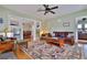 Cozy living room with hardwood floors, comfortable seating, and an open layout at 303 Washington St, New Smyrna Beach, FL 32168