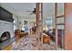 Inviting living room with hardwood floors, fireplace, and open view to dining area at 303 Washington St, New Smyrna Beach, FL 32168