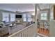 Open living room featuring hardwood floors, neutral colored furniture, and bright windows at 303 Washington St, New Smyrna Beach, FL 32168