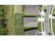 An aerial view focusing on rooftops, lawns, and driveways, showcasing the layout of homes at 3245 Carpentaria Dr, New Smyrna Beach, FL 32168