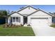 Charming single-Gathering home featuring a two-car garage and well-manicured lawn and landscaped beds at 3245 Carpentaria Dr, New Smyrna Beach, FL 32168