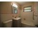 Clean bathroom with a retro pink tile, neutral paint, modern vanity, and new toilet at 349 Fletcher Ave, Daytona Beach, FL 32114