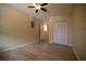 A bright bedroom with wood-look floors, neutral paint, a ceiling fan, and closet at 349 Fletcher Ave, Daytona Beach, FL 32114