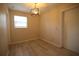 A bright dining room features wood floors, a window and modern light fixture at 349 Fletcher Ave, Daytona Beach, FL 32114