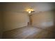 Bright living room with modern wood-look flooring, neutral walls and a doorway to another room at 349 Fletcher Ave, Daytona Beach, FL 32114