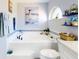 Bathroom with a soaking tub, decorative artwork, and a built-in window seat at 3611 Marisol Ct, New Smyrna Beach, FL 32168